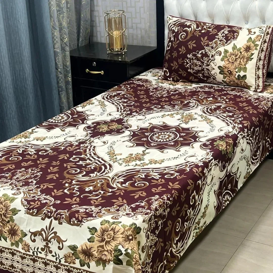 Bed with floral patterned bedspread in a bedroom setting