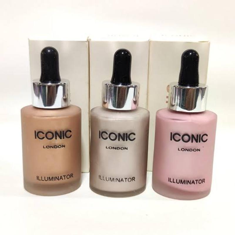 Three bottles of Iconic London Illuminator with dropper caps on a white background