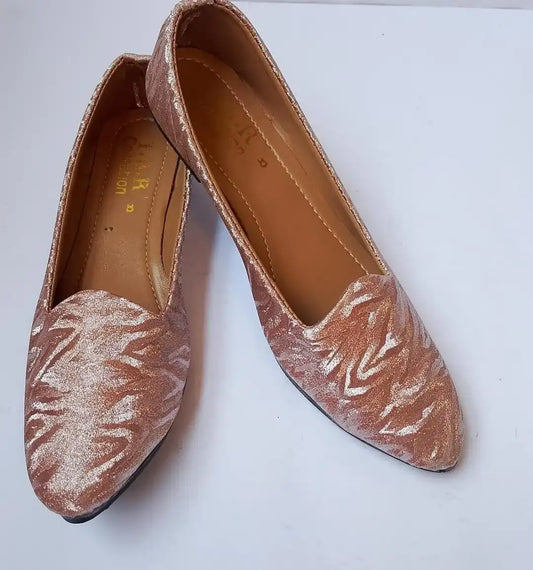Pair of patterned flats on a white background