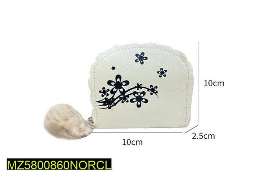 Small white pouch with floral design and pom-pom on a white background