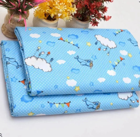 Blue fabric with cartoon designs on a white background