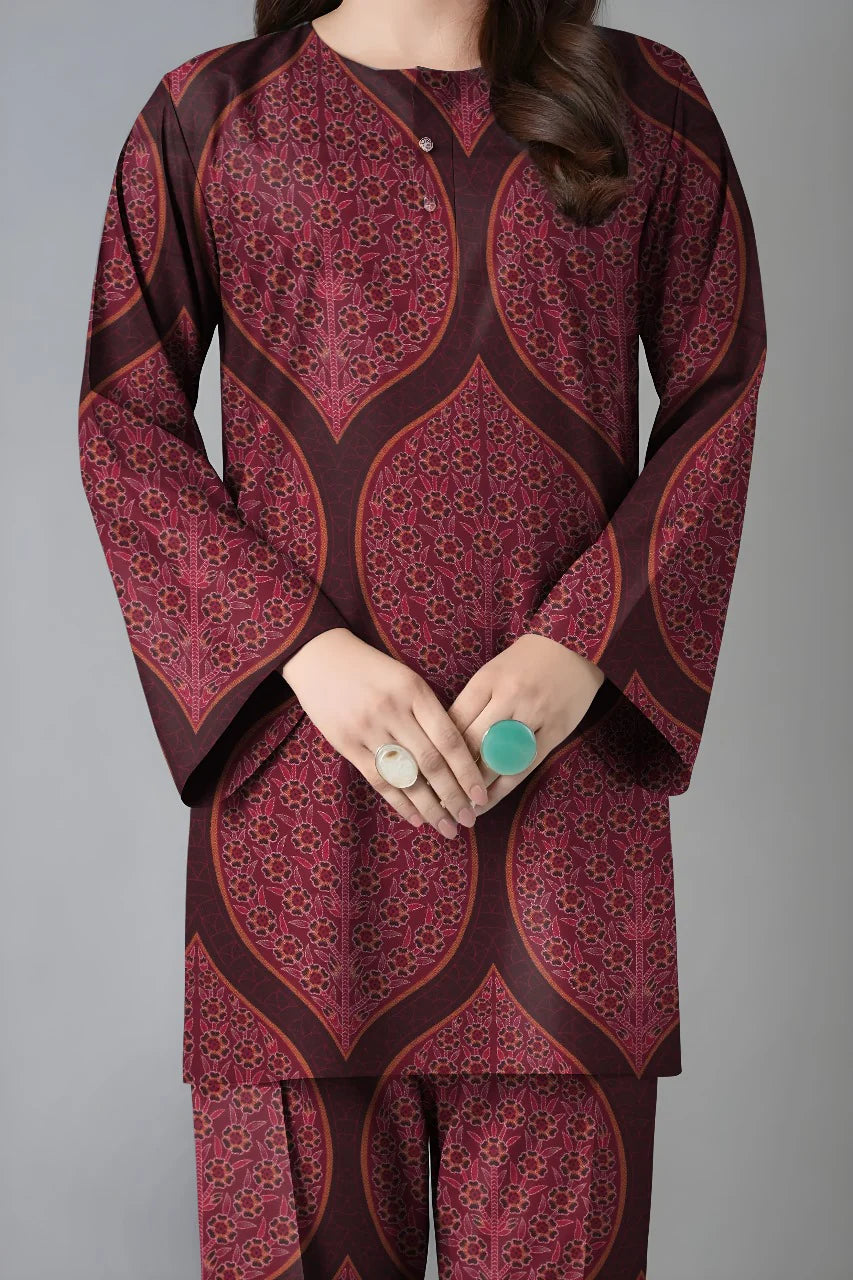 Maroon and brown patterned outfit on a gray background