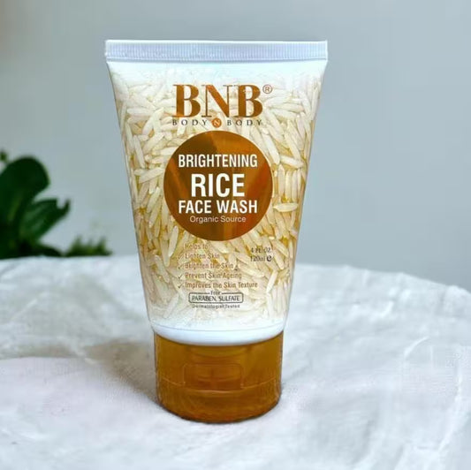 Tube of BNB Brightening Rice Face Wash on a white surface with a blurred background