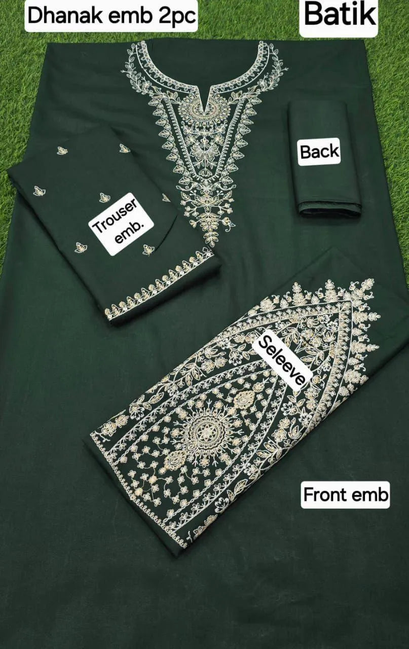 Green outfit with white embroidery labeled 'Dhanak emb 2pc', 'Batik', 'Front emb', 'Back', and 'Trousers emb'.