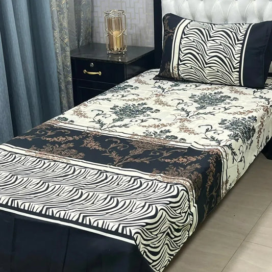 Bed with floral and zebra print bedding in a bedroom setting.