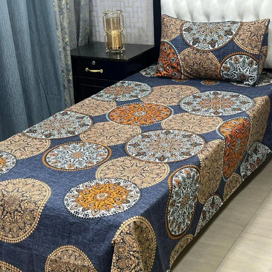 Decorative bedspread with circular patterns on a bed in a bedroom setting.