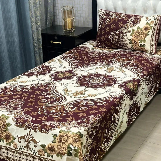 Bed with floral patterned bedspread in a bedroom setting