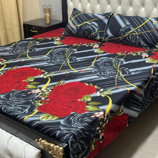 Floral bedsheet with red roses on a bed in a bedroom setting
