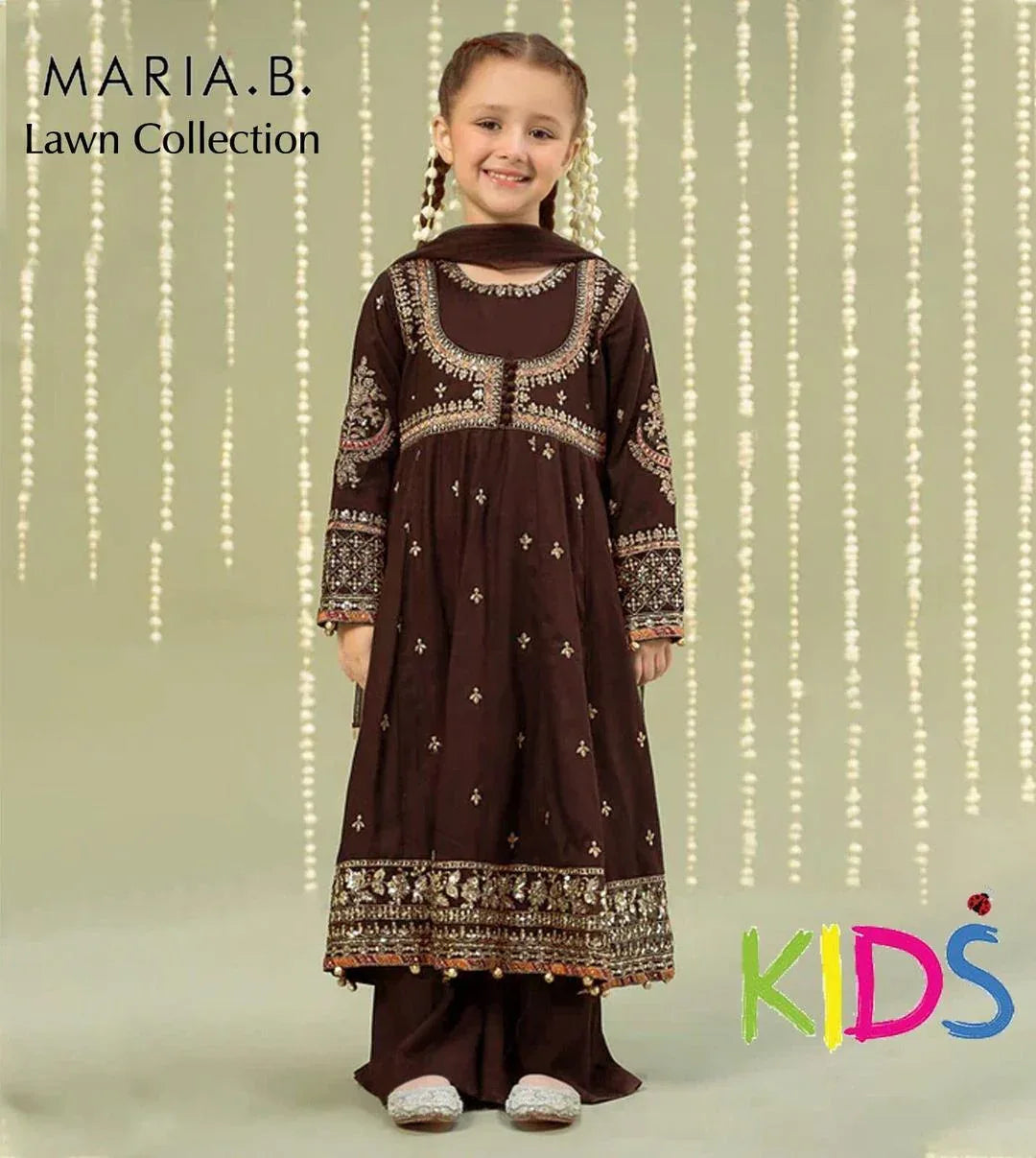 Young girl wearing a brown embroidered outfit with 'Maria B' branding on a beige background.
