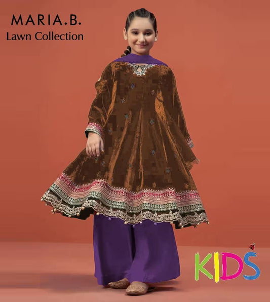 Young girl wearing a brown and purple dress with intricate patterns on a red background, featuring 'Maria.B' branding.