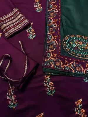 Embroidered fabric with intricate patterns on a purple background