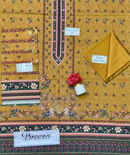 Textile with intricate patterns and 'Breeza' branding on a yellow background