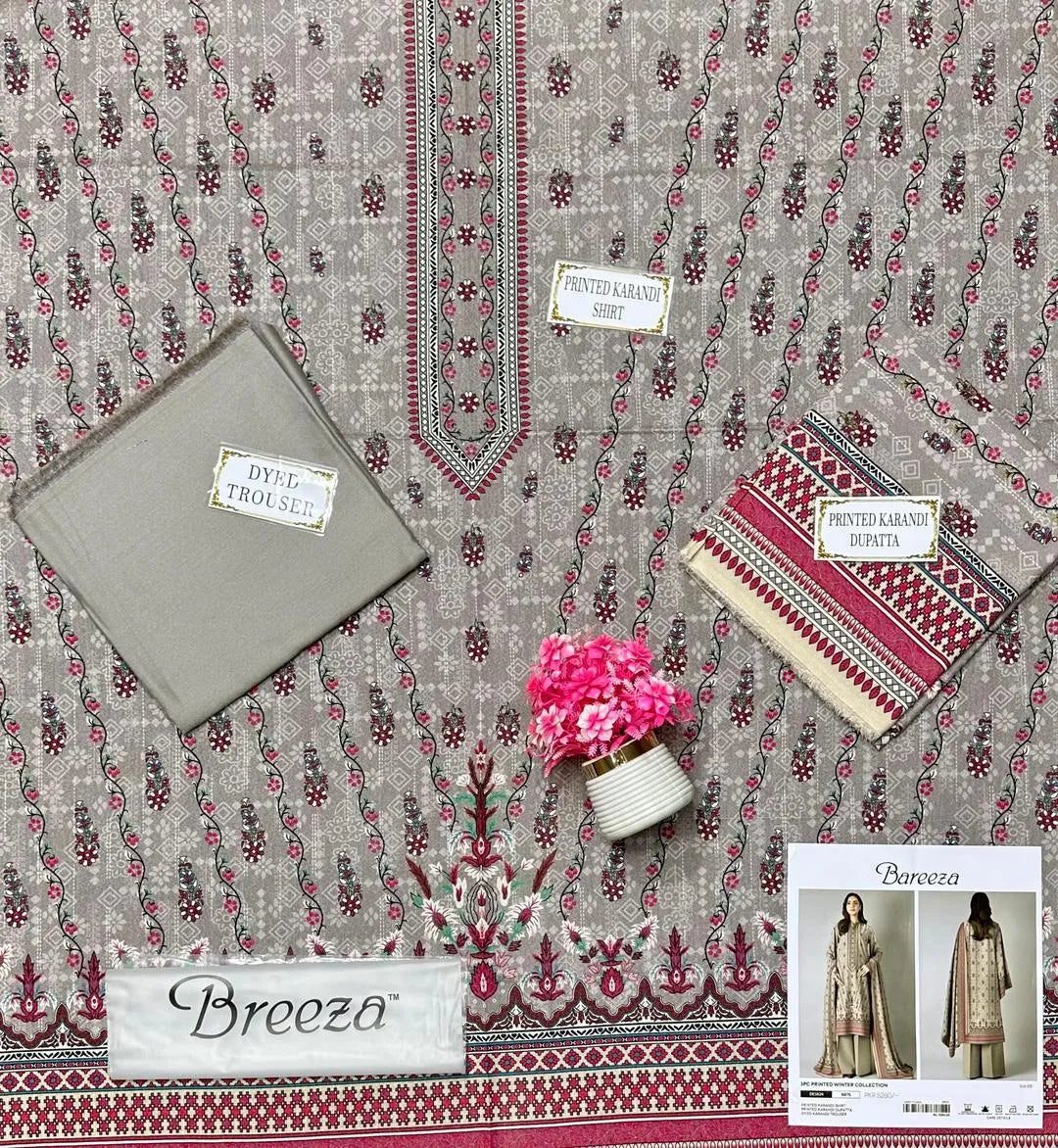Textile with floral patterns and 'Breeza' branding, featuring a small plant and folded fabric.