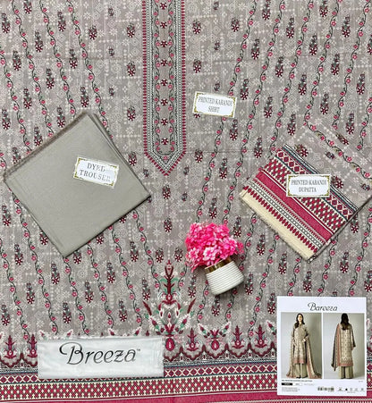 Textile with floral patterns and 'Breeza' branding, featuring a small plant and folded fabric.