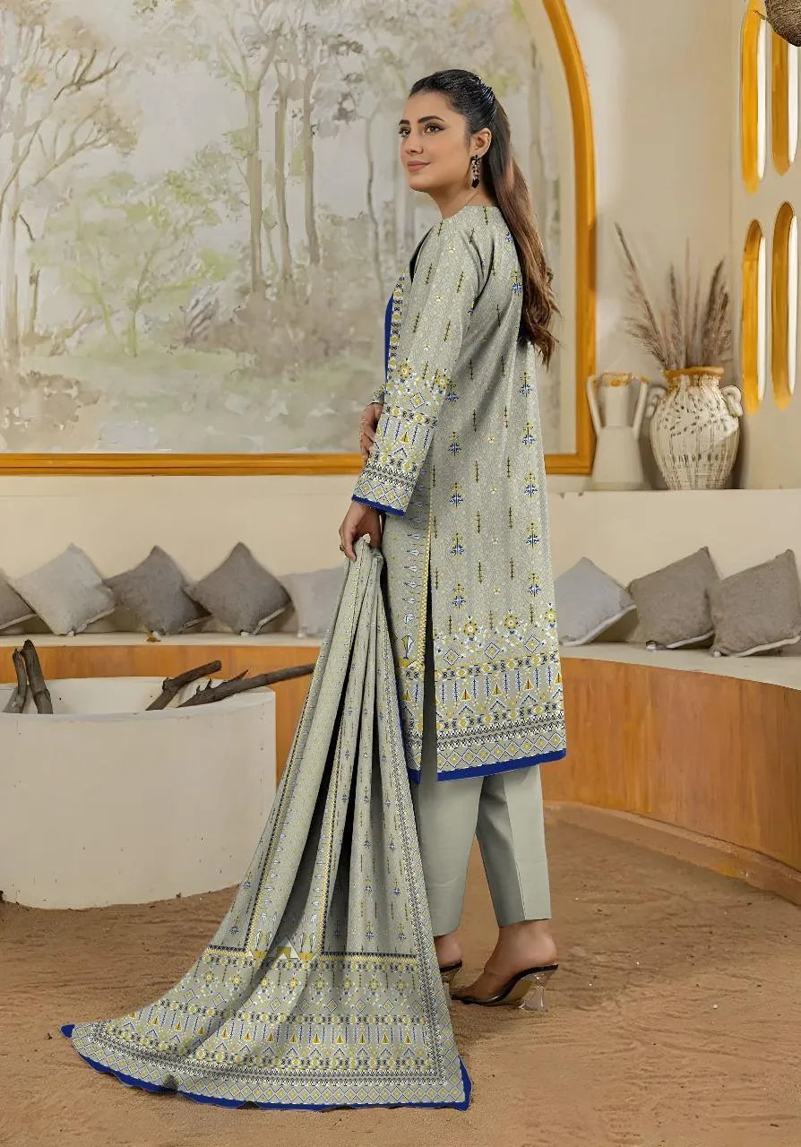Woman holding a traditional outfit in a decorated room with vases and cushions.