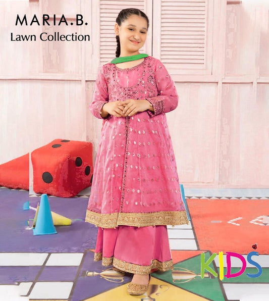 Young girl in a pink traditional outfit with 'Maria B' branding, standing on a colorful play mat.