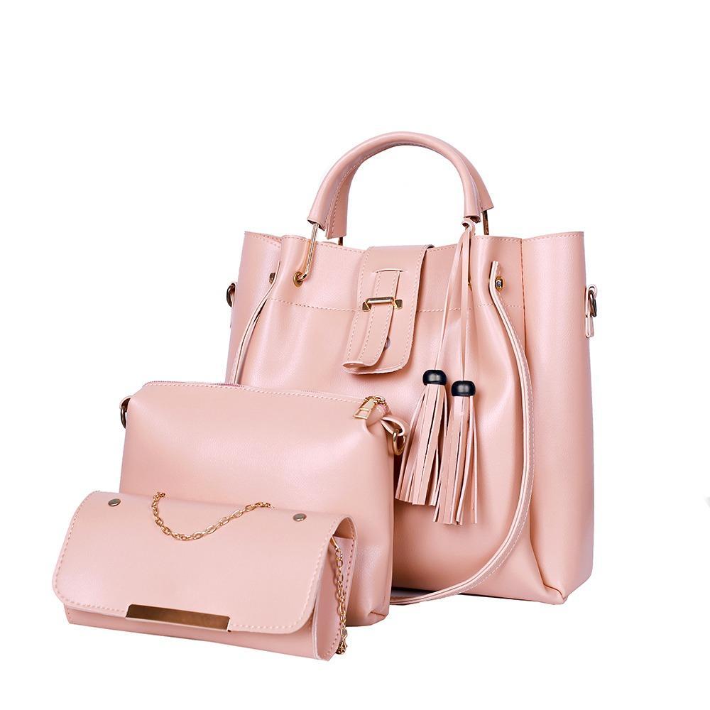 Pink handbag with matching wallet on a white background