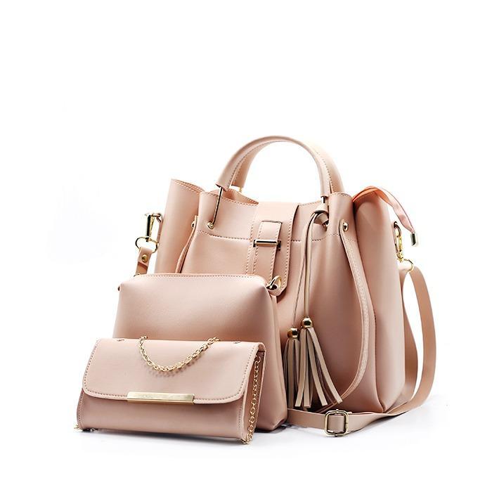 Pink handbag set with a smaller purse on a white background