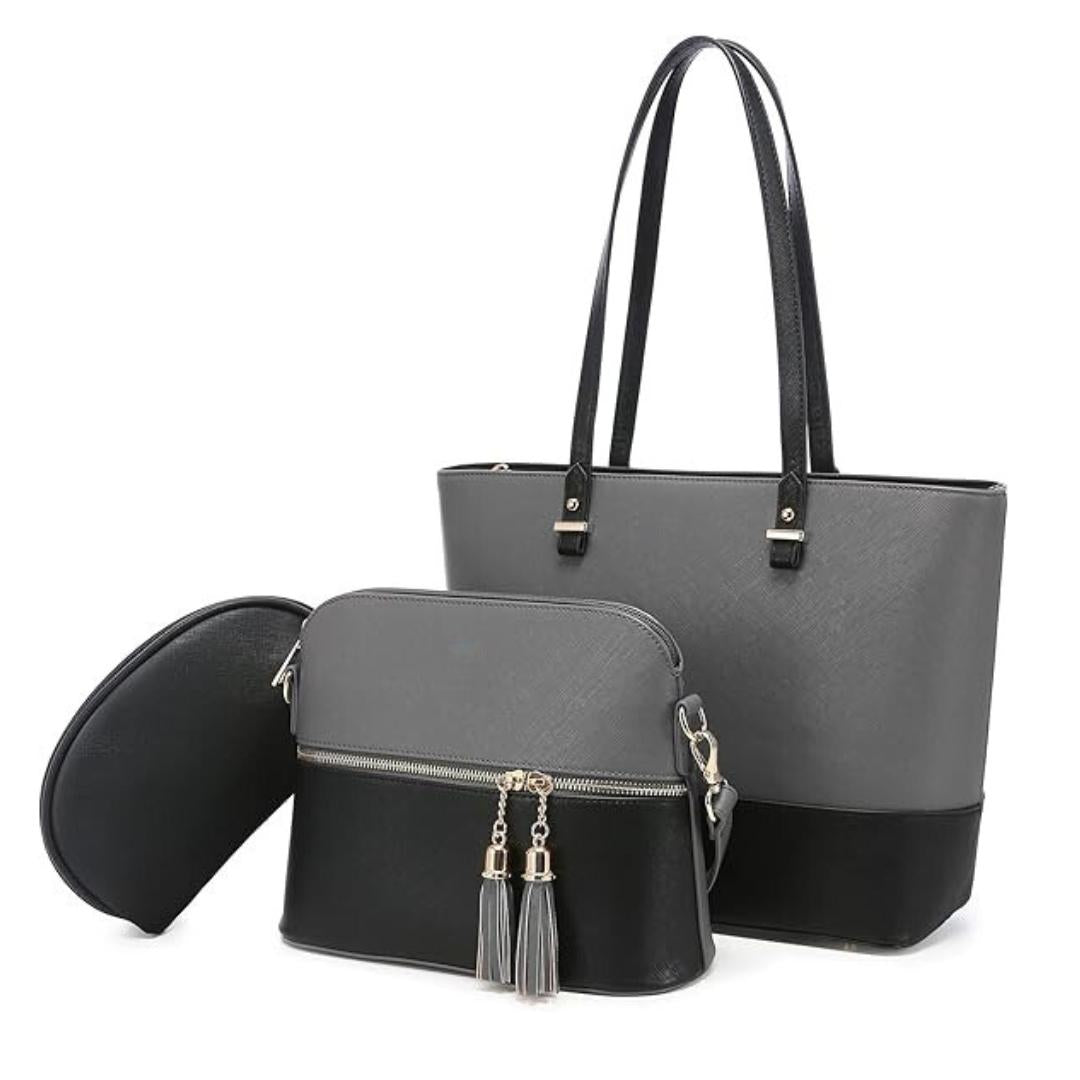 Two-handled gray tote bag with a smaller black bag featuring tassels on a white background