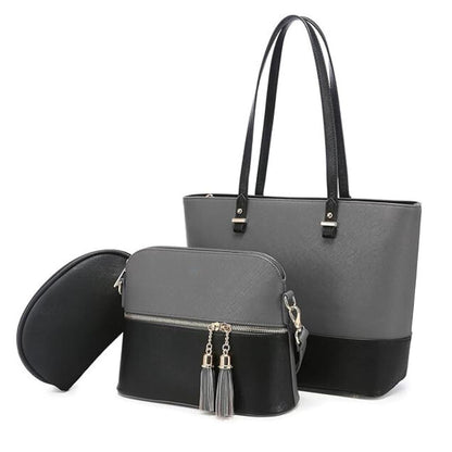 Two-handled gray tote bag with a smaller black bag featuring tassels on a white background
