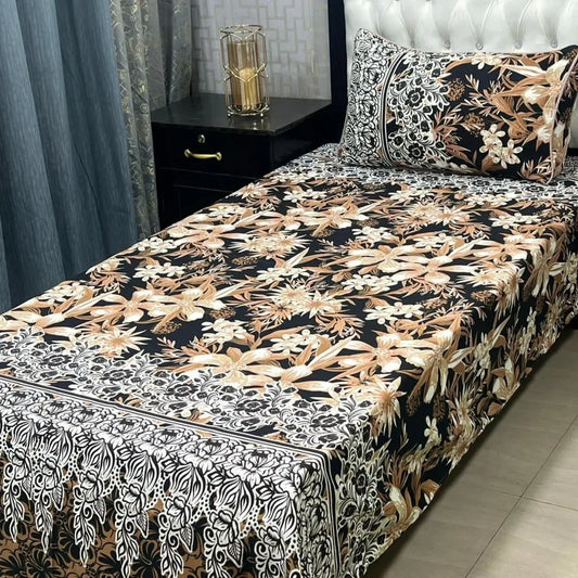 Bed with floral patterned bedspread in a bedroom setting