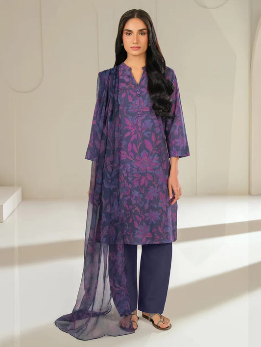 Woman wearing a purple floral outfit in a minimalistic setting