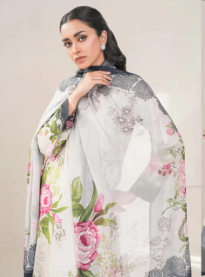 Woman wearing a floral scarf with a neutral background