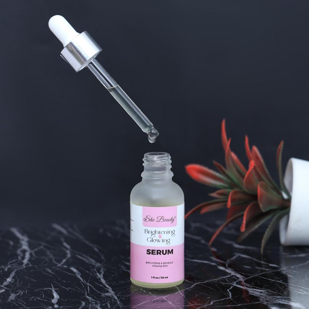 Serum bottle with dropper on a dark surface with a plant in the background