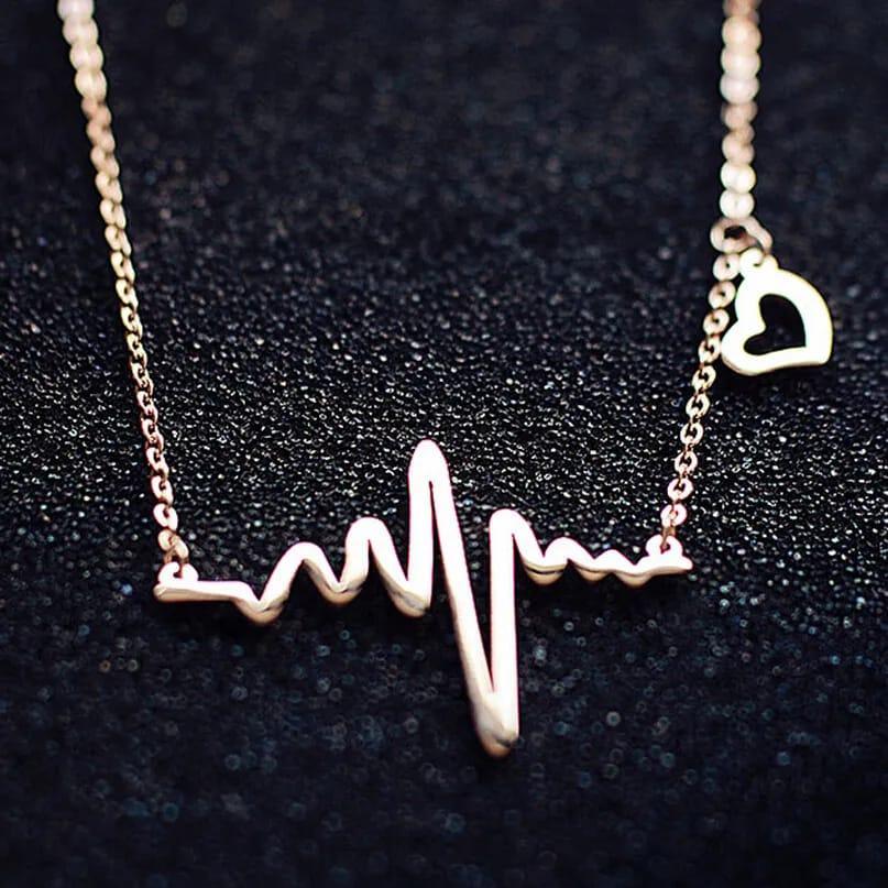 Necklace with a heart rate design on a dark background