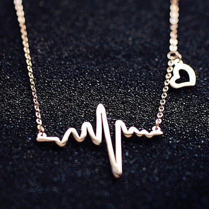 Necklace with a heart rate design on a dark background