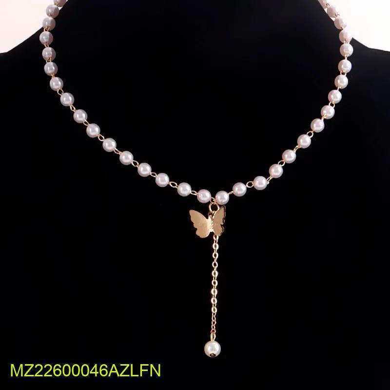 Pearl necklace with a butterfly pendant on a black background