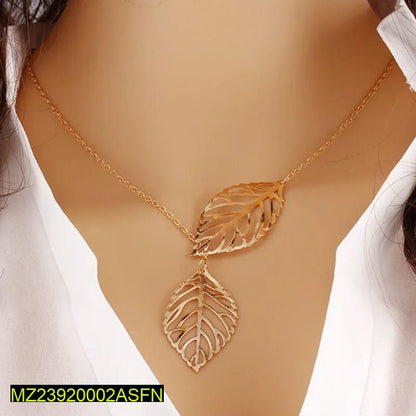 Gold leaf necklace on a mannequin with a white background