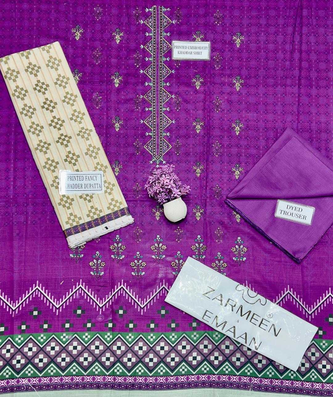 Purple fabric with white and green patterns, including a saree and blouse on a matching fabric background.