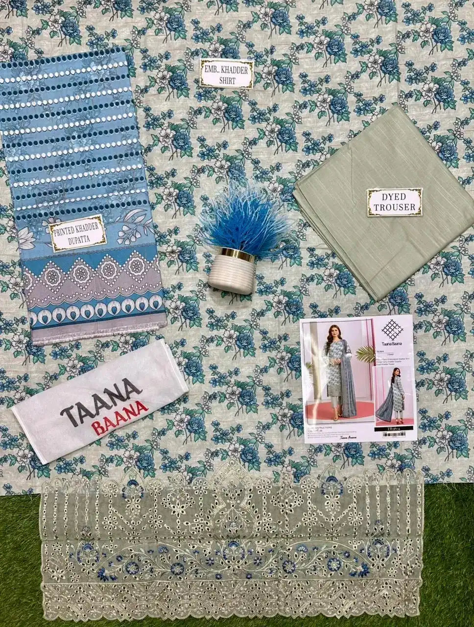 Fabric samples and promotional material on a floral fabric background