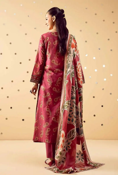 Woman wearing a pink traditional outfit with a floral dupatta against a beige background
