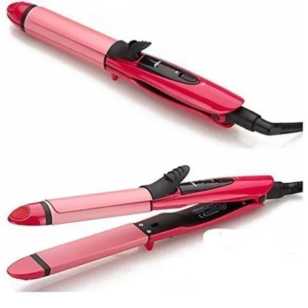 Pink hair straightener and curler on a white background