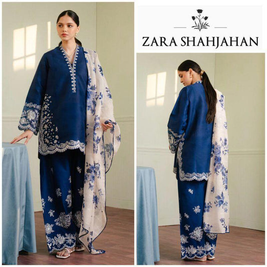 Woman wearing a blue and white floral outfit with Zara Shahjahan branding.