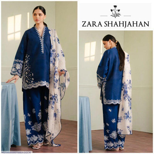 Woman wearing a blue and white floral outfit with Zara Shahjahan branding.