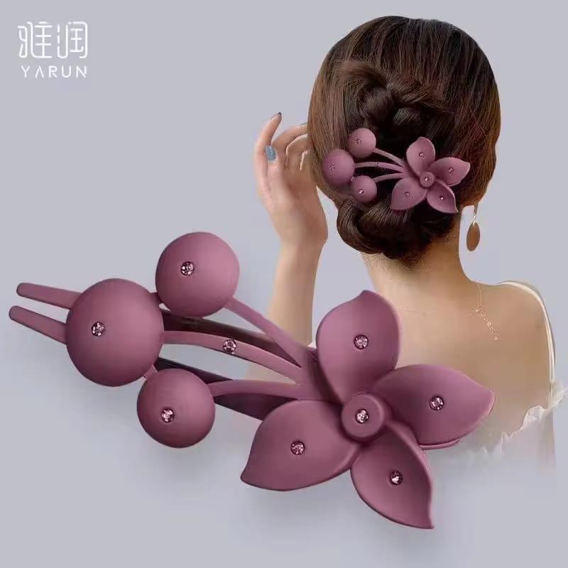 Purple hair clip with floral design worn by a person, brand 'YARUN' visible