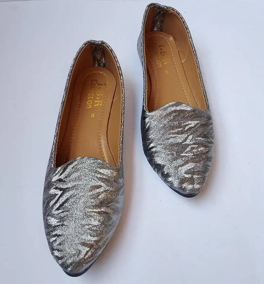 Pair of silver loafers on a white background