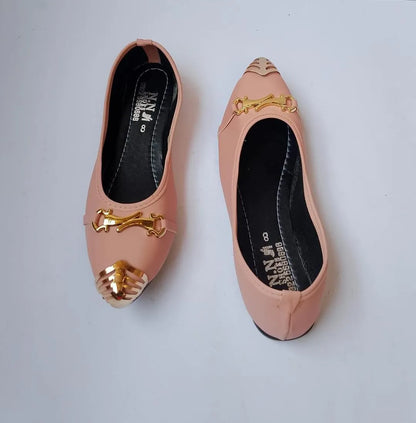 Pair of pink shoes with gold accents on a white background
