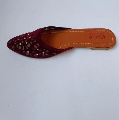 Maroon slip-on shoe with cut-out design on a white background