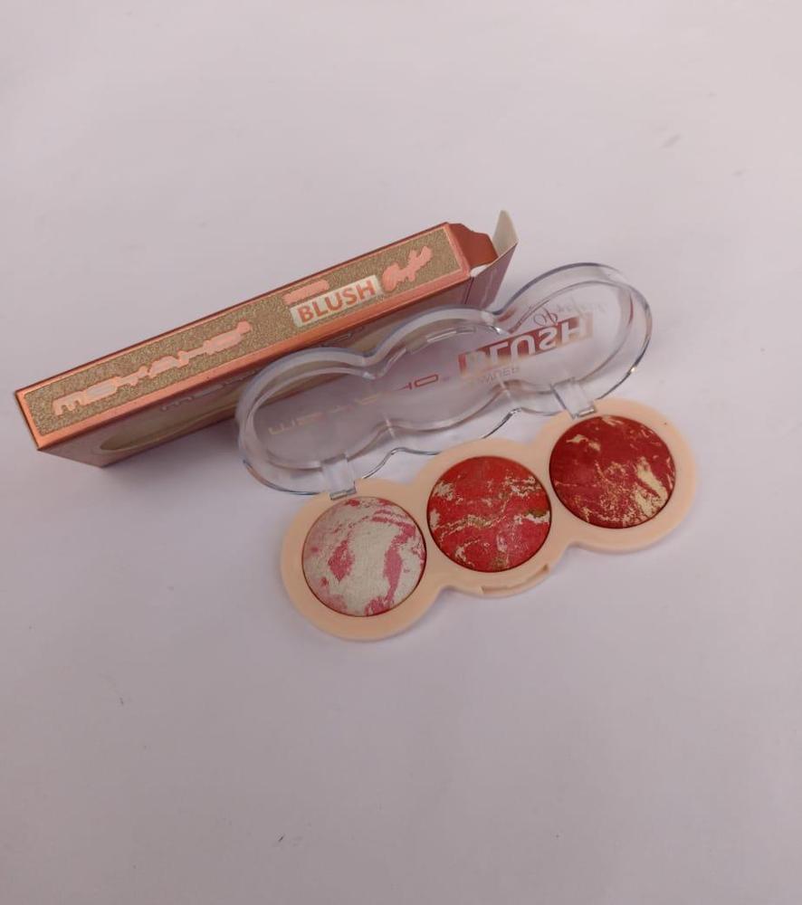 Makeup product with blush and applicator on a light gray background