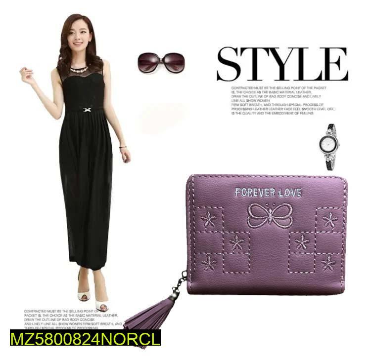 Woman in black dress with purple wallet, sunglasses, and watch on white background