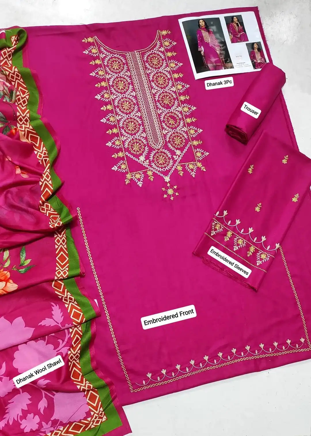 Pink embroidered fabric with green border and packaging on a white background