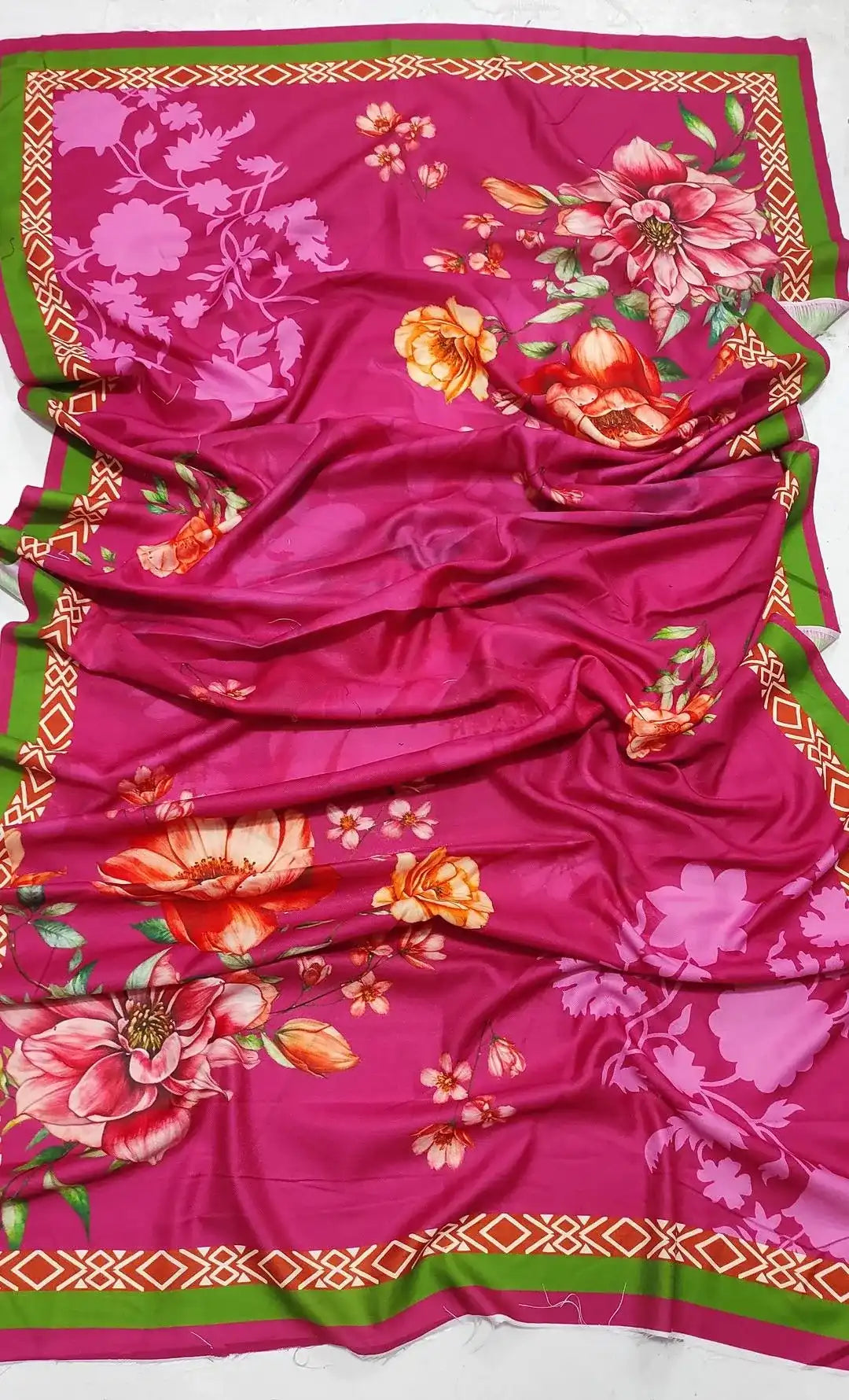 Pink fabric with floral patterns on a white background