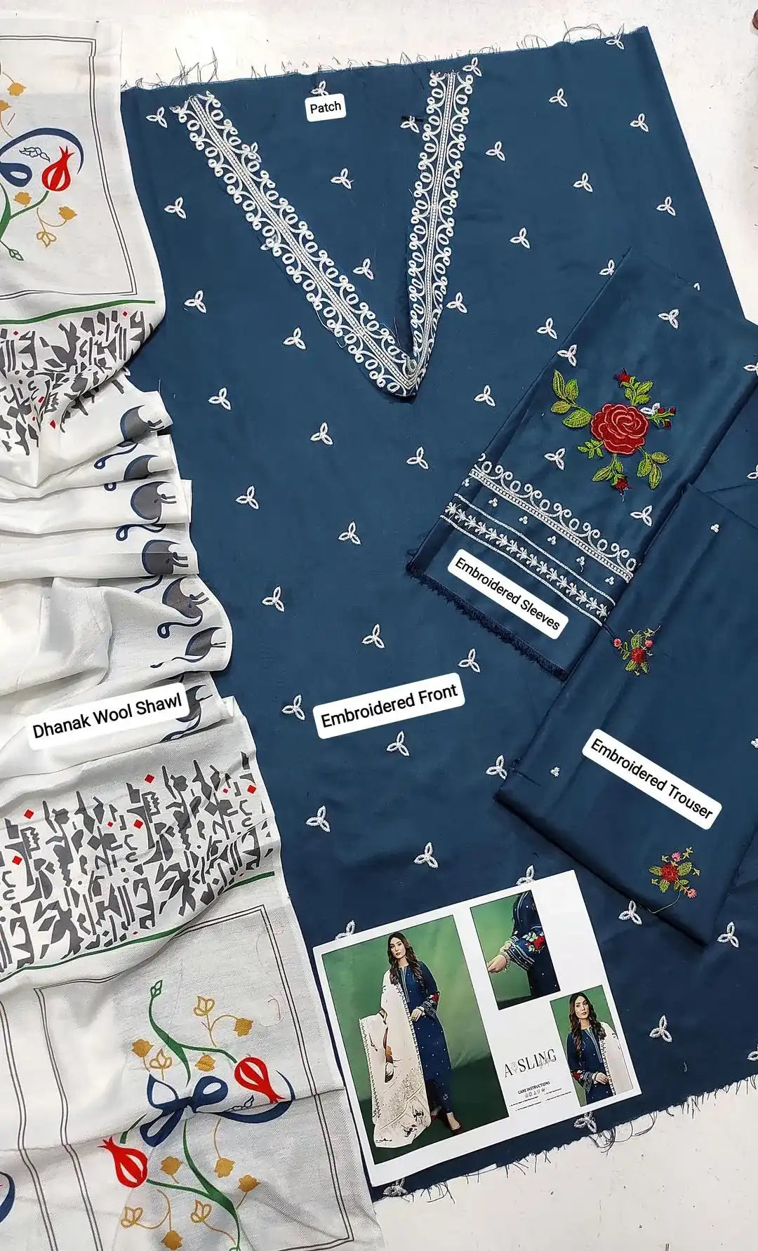 Collection of embroidered clothing and accessories on a white background