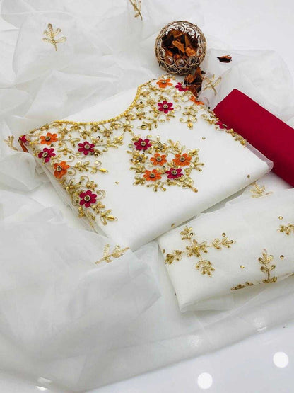 White fabric with gold embroidery on a white background