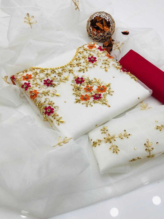 White fabric with gold embroidery on a white background