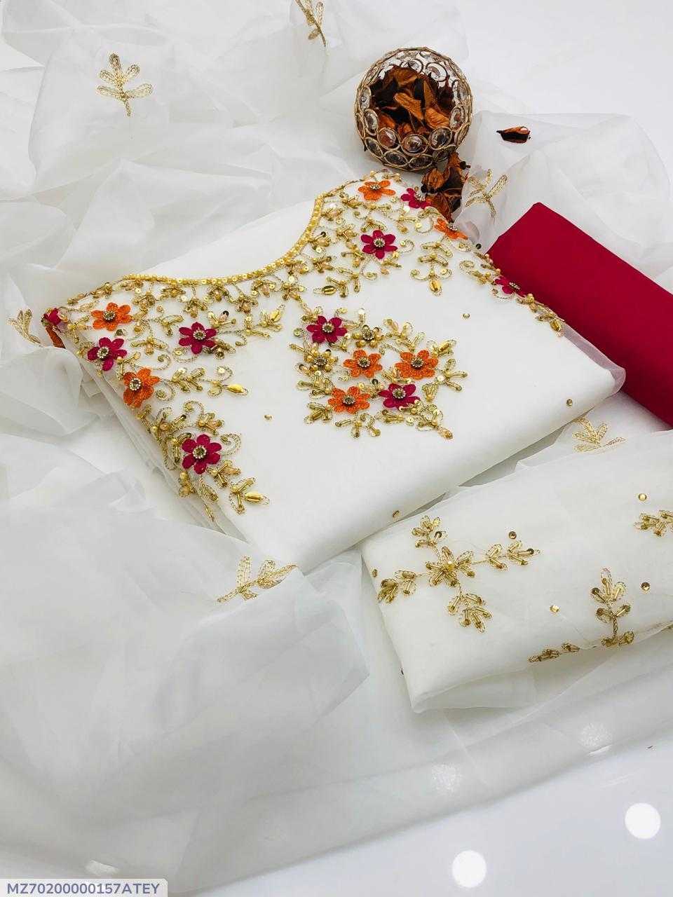 White fabric with gold embroidery on a white background